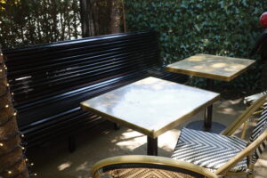 A bench and table in the sun
