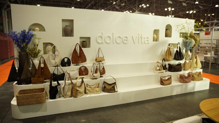 Dolce Vita displaying handbags on a custom display wall